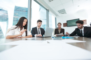 Business people working together at a meeting