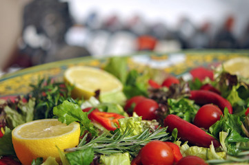 Perfect vegetarian fresh seasonal salad and wine on wooden table