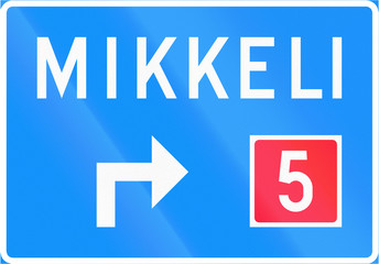 Finnish road sign no. 631. Advance direction sign (above the lane, type A)