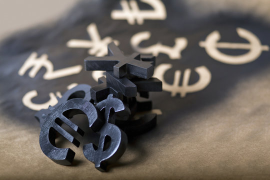 International black currency units on dappled background