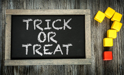 Trick or Treat? written on chalkboard