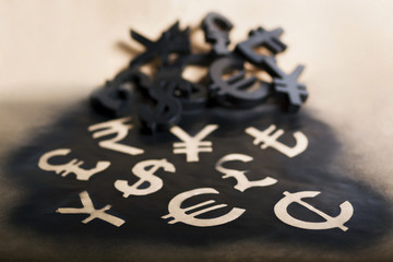 International black currency units on dappled background