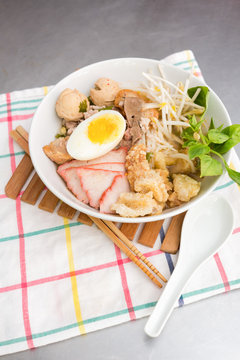 Pork rice noodle soup with meat ball, egg and vegetable