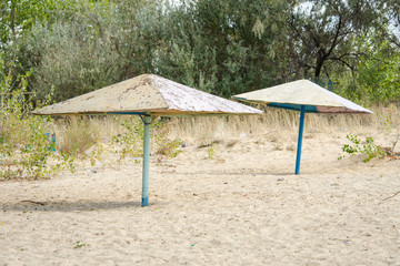 Old metal beach umbrellas on the beach