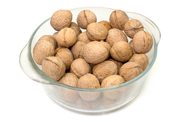 Glass dish with walnuts