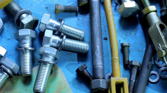 Wrenches and bolts on table close up
