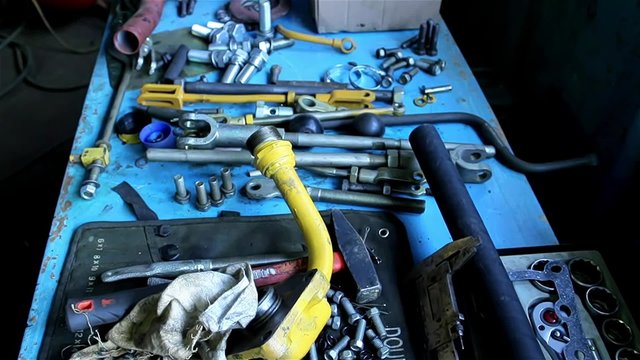 Wrenches and bolts on table close up