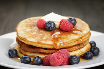 Pancakes with raspberry, blueberry and maple syrup