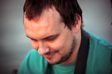 Obraz premium Handsome young man relaxing on a yacht, blue summer vacation 