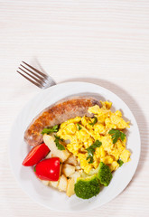 Scrambled egg with sausage and vegetables