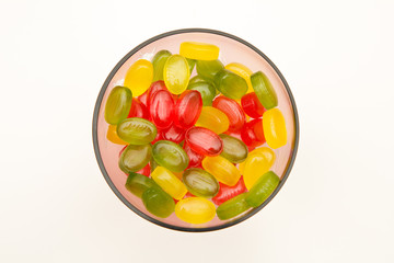 heap colors candy in glass bowl