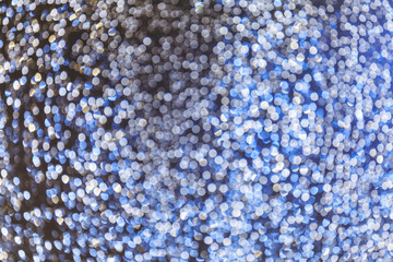 Festive abstract blue and silver bokeh background
