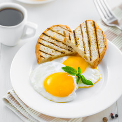 Fried eggs with coffee. Traditional healthy food for breakfast.