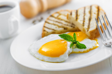 Fried eggs with coffee for delicious breakfast