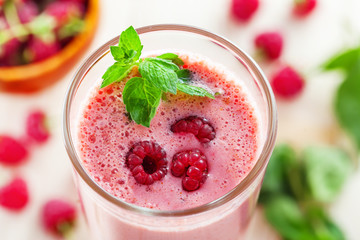 Raspberry smoothie on table. Healthy drink. Close-up shot