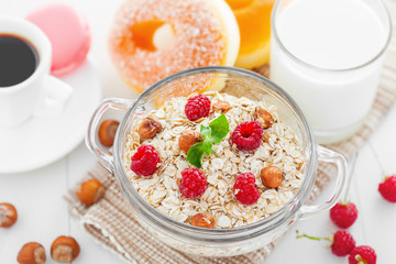 Oatmeal healthy breakfast with coffee, muesli with fruits and nuts. Top view.