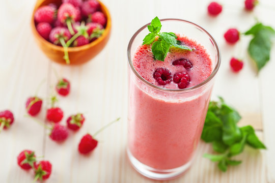 Fruit smoothie drink made of fresh raspberry and mint.