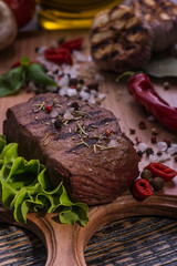Beefsteak  on the wooden background