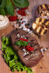 Beefsteak  on the wooden background