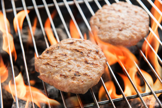 Hamburgers on Grill with Dancing Flames Cooked
