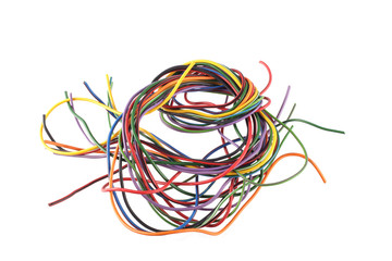 Close up photo of multicoloured wire on a white background.