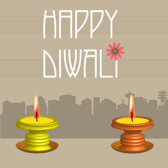 Abstract colorful background with two candles and the text Happy Diwali written with white letters