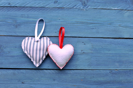 Two hearts on blue  wooden background