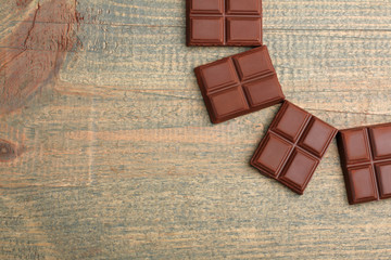 gentle milk chocolate on wooden background