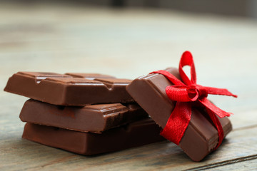 gentle milk chocolate on wooden background