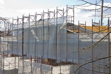 Fototapeta premium Metal scaffolding for the restoration of a building facade
