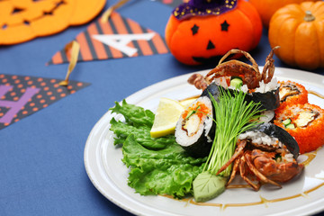 spider roll, maki sushi made of soft shell crab tempura and sushi rice, halloween party dinner

