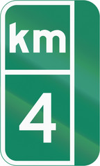 Guide and information road sign in Quebec, Canada - Milestone sign with distance in kilometers, version for the right side of the road