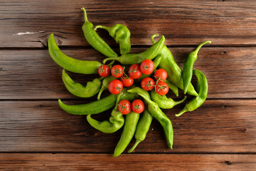 peppers oxtail with tomatoes and garlic on wooden table