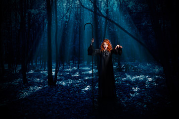 Witch in night forest