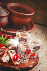 Vodka with spicy red pepper, bacon and garlic, Russian tradition