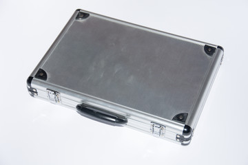 Old aluminium case on the white background