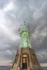 Naklejka premium Ultra wide view of lighthouse in Kobe, stormy clouds Japan