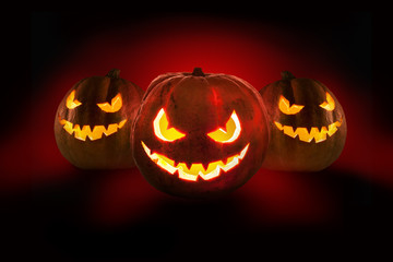 Halloween pumpkins on the dark background.