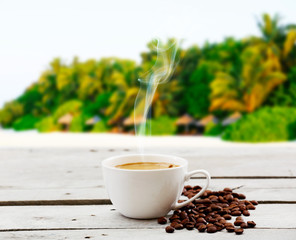 Cup of coffee on table on bright background