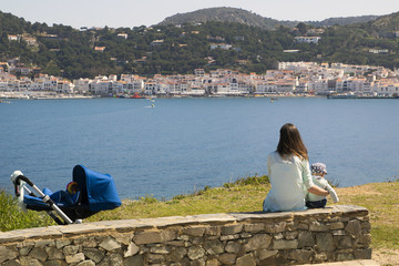 Mom and son sitting in the coast