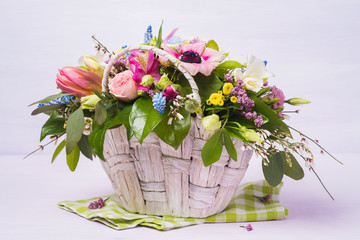 Basket with decorative flowers, closeup