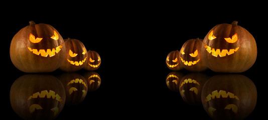 Halloween pumpkins on the dark background.