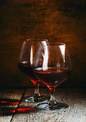 Two glasses of cognac, selective focus