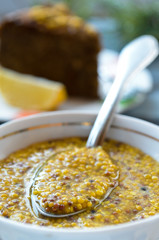 Mustard sauce on wooden table