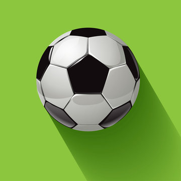 Soccer ball with long shadow on a green background. Vector illustration.