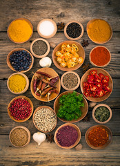 Plakat Various spices and herbs on the wooden background