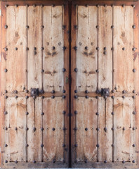 Double doors of antique wood and metal nails, Mallorca, Balearic islands, Spain.
