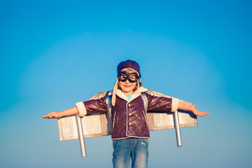 Happy child playing with toy airplane © Igor Yaruta