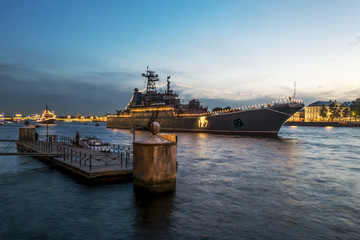 Fototapeta premium Warships in the waters of the Neva River in St. Petersburg at ev