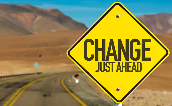 Change Just Ahead sign on desert road